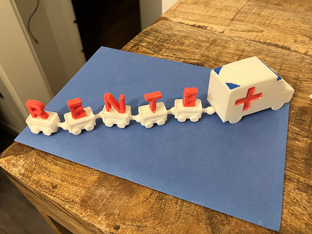 Rettungswagen mit 5 Anhängern. Jeder Anhänger trägt einen Buchstaben des Wortes RENTE